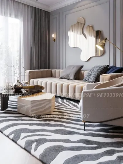 A close-up of a contemporary living room, highlighting the channel-tufted sofa and a bold zebra-print rug. The uniquely shaped mirror and floor lamp add an artistic touch to the space.