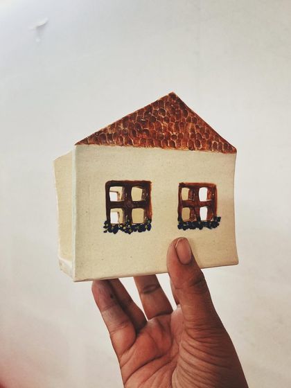 This student explored all four major techniques in her beginner's course, creating these beautiful pieces, including a delicate pierced vase and a little house luminary.