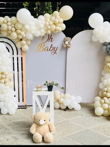 To celebrate a new arrival, I designed this dreamy and modern "Oh Baby" shower. The neutral color palette with soft whites, creams, and grays, accented by gentle balloon arrangements and a cute teddy bear, creates a warm and welcoming atmosphere for the parents-to-be.