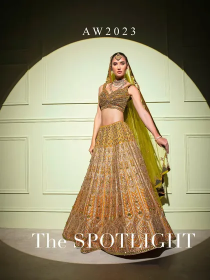 The magnificent gold bridal lehenga, featured as part of "The Spotlight" collection, perfect for the bride who wants a truly grand entrance.