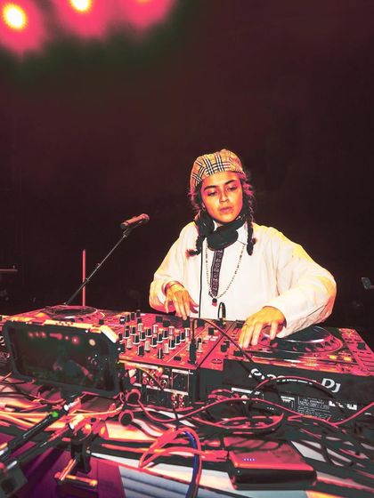 A portrait of DJ Offering Rain, part of an all-queer lineup for a Bollywood Disco event. I am intentional about creating platforms that are by and for the queer community.