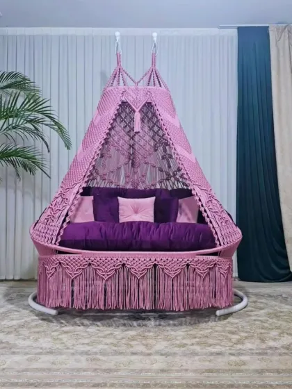 A beautiful pink and purple combination for a sofa-style swing. This piece stands on its own frame, making it easy to place in any room or covered patio area.