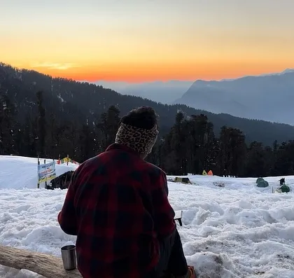Moments when life starts feeling unreal. Watching the sunset from a snow-covered campsite on the Kedarkantha trek.