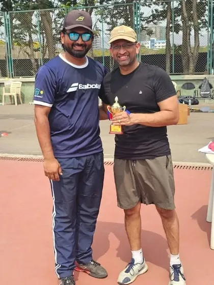 An adult player from our men's team celebrating his victory.