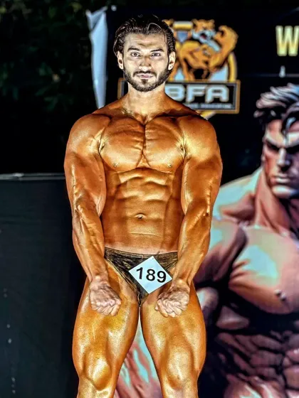 On stage, under the lights, is where hard work is revealed. I build physiques that are not just muscular but also aesthetic and balanced, ready to dominate the competition.
