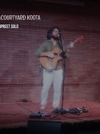 A shot from a solo performance by Harpreet, a singer-songwriter whose music blends folk traditions with contemporary arrangements. Our stage is a welcoming space for solo artists to connect with their audience.