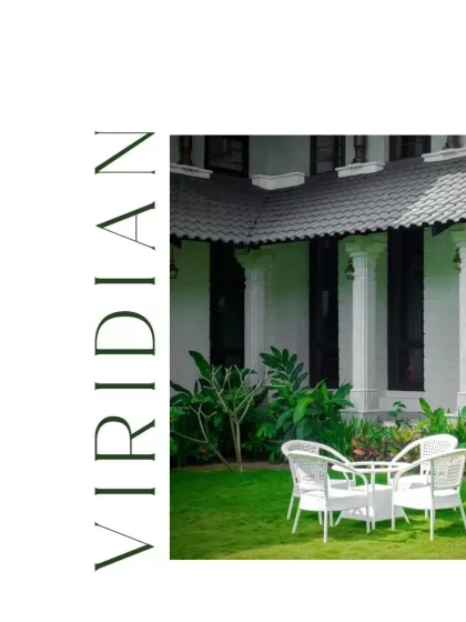 Discover serenity in this tranquil outdoor retreat. A simple white table and chairs set on a manicured lawn provide a classic and elegant spot to unwind amidst the greenery.