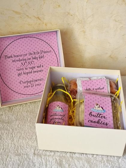 "Thank heaven for the little princess." This personalized baby girl announcement box is filled with our handmade goodies like butter cookies and date & walnut cake.