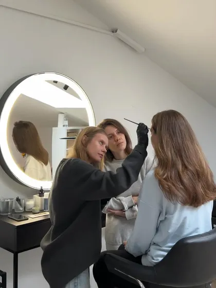 We keep our classes small to give you our full attention. In this photo, an instructor is demonstrating the correct brush technique for eyebrow coloring, while a student observes closely. This personalized approach is key to building confidence and skill.