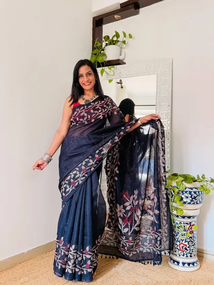 This navy blue saree with a delicate floral print border is another great find for under 599. It's elegant, understated, and perfect for daily office wear.