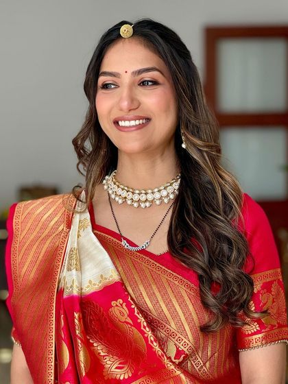 A glowing and growing mama to be for her godbharai, or baby shower. We created a soft glam look with beautiful waves in her hair, perfect for this special celebration.