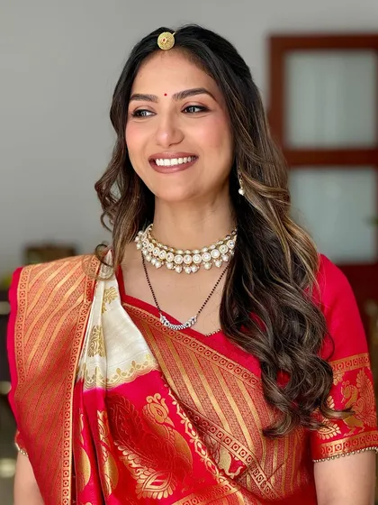 A glowing and growing mama to be for her godbharai, or baby shower. We created a soft glam look with beautiful waves in her hair, perfect for this special celebration.