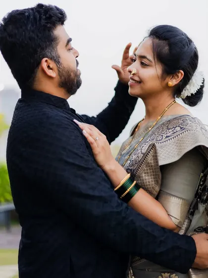 A playful and affectionate moment between the couple. Capturing these little gestures is key to showing a couple's unique bond.