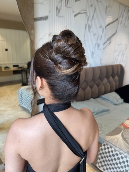 The back view of this complex updo, showing the interwoven sections that create its unique texture and shape.