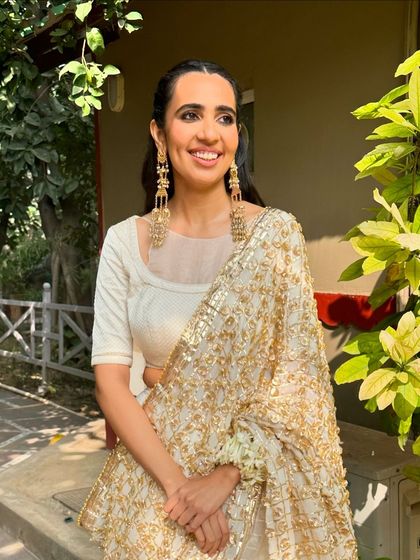 The full look for this bride's Haryanvi-inspired Mehendi. Her radiant smile and the traditional elements of her makeup and hair came together to create a look that was truly heartfelt and beautiful.