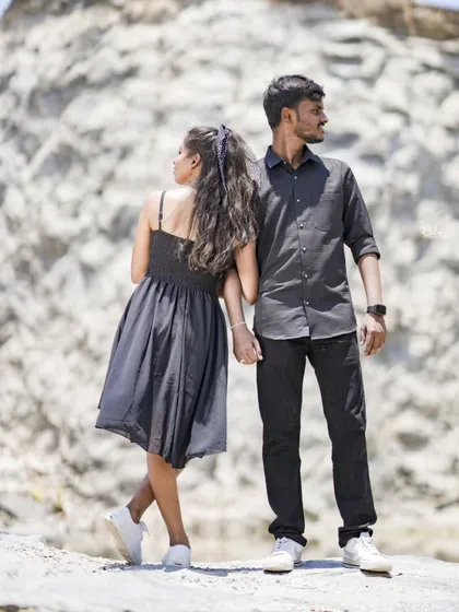 A romantic and thoughtful pose at a rocky quarry. The simple, dark outfits look great against the natural, rugged backdrop.