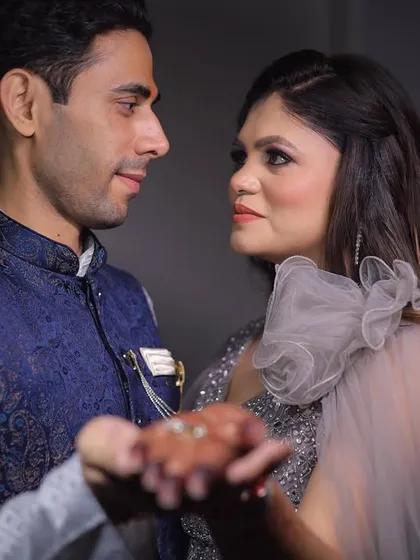 A close up shot of the couple dancing, focusing on their expressions and the ring. This intimate framing tells a story of love and promise.