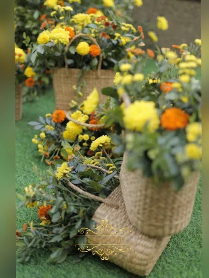 More of the beautiful floral arrangements in cane baskets, adding a touch of rustic charm to the Haldi ceremony.