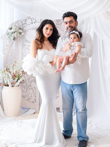 A beautiful family portrait with everyone dressed in white. This classic color scheme creates a bright, airy, and timeless look.