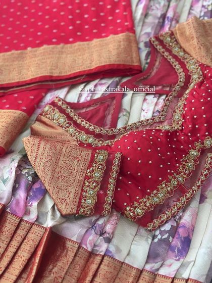 The full layout of the red blouse with brocade details.
