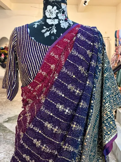 The combination of the striped sequin blouse with the ombre embroidered saree gives the 'ROOP' a unique and modern feel.