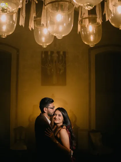 A tender forehead kiss under an antique chandelier. This intimate moment from the Pondicherry shoot is full of warmth and romance.