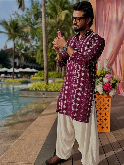 A side profile, showing the details of the kurta.
