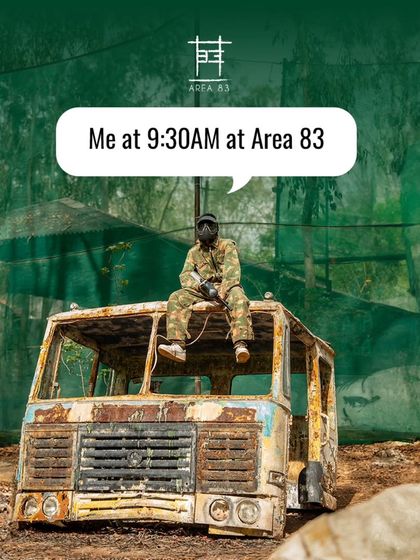 Me at 9:30 AM at Area 83. Ready for action, perched on top of a rustic truck in the paintball zone.