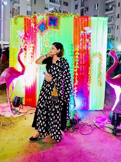A more dynamic pose in the same Dussehra outfit, showing the flow and design of the dupatta.