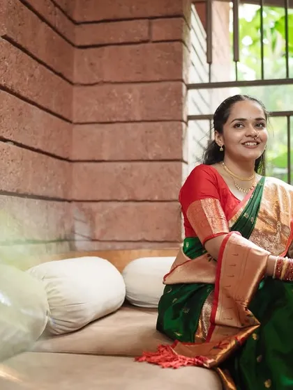 A beautiful, engaging portrait of the bride looking directly at the camera. Her warm smile invites you into her story, showcasing her confidence and happiness.