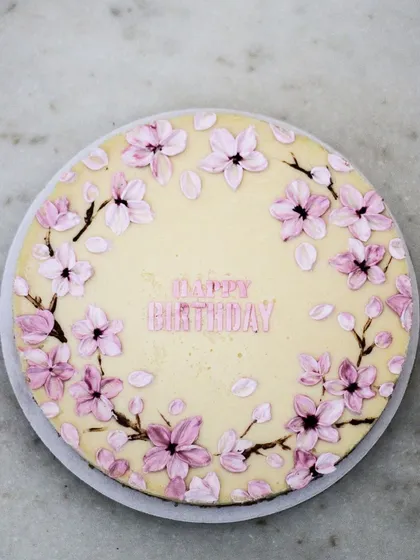 My artistic creations are not just for cakes. This creamy baked cheesecake is decorated with delicate, hand-painted cherry blossoms. It’s a beautiful and delicious alternative for someone who loves cheesecake and wants a truly unique design for their celebration.