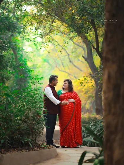 A romantic portrait of the couple framed by the natural foliage of the park. This shot has a lovely, intimate feel.