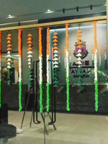The entrance to the office was decorated with hanging garlands made of artificial flowers in the tricolour theme, creating a welcoming and patriotic first impression for employees and visitors on Independence Day.