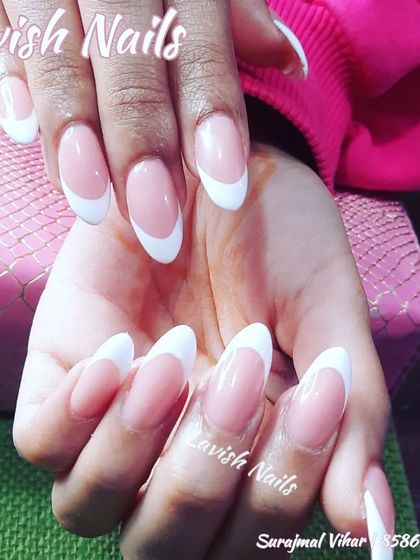A classic French manicure on long, oval-shaped nails, perfect for any occasion.