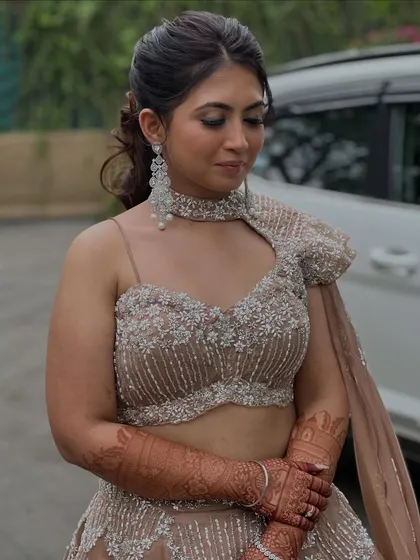 A close-up of Simran's Sangeet makeup, featuring my signature glass skin finish and soft, defined eyes.
