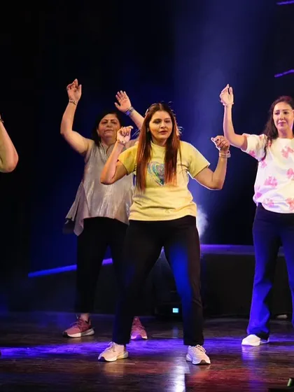 Hands up if you love a good workout! Our members celebrating the rhythm on stage.