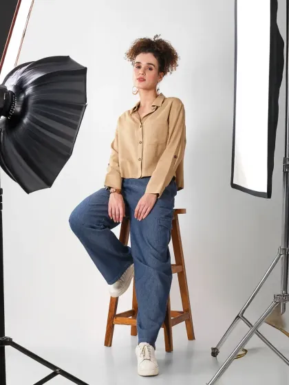 A behind the scenes style shot that includes the studio lights, giving customers a glimpse into the professional process of creating the final image.