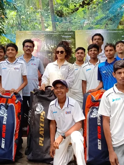 Our boys proudly pose with the donated cricket kits alongside actress Saiyami Kher.