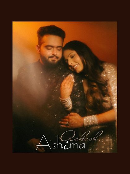 A warm, softly lit portrait of a couple, capturing a tender moment during their engagement shoot.