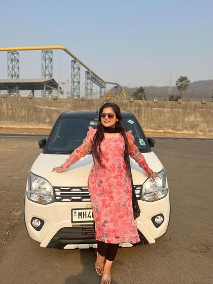 My client posing in her custom floral organza kurta. It's a versatile piece that can be dressed up or down for any casual occasion.