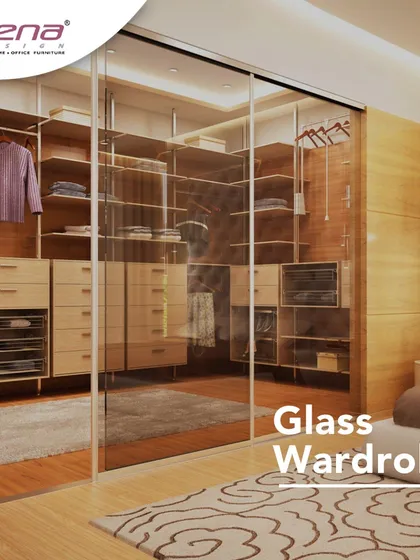For those who want a boutique-like feel, we design glass wardrobes. This sliding glass door provides a clear view of the organized clothes and accessories inside, with custom drawers and shelves making everything accessible.
