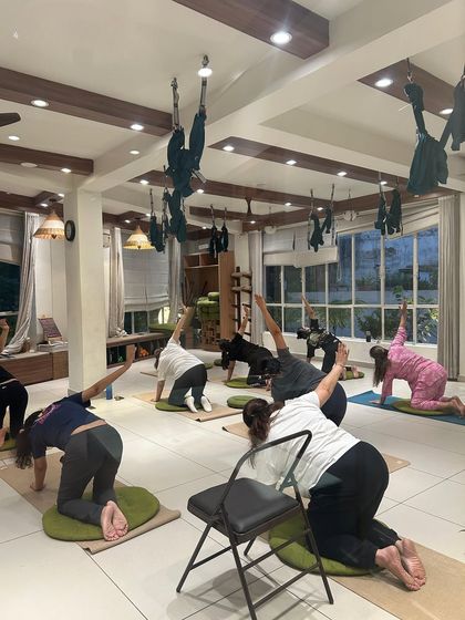 A full class using various props like chairs and wheels to modify and enhance their practice. This demonstrates our philosophy that yoga is adaptable for every individual.