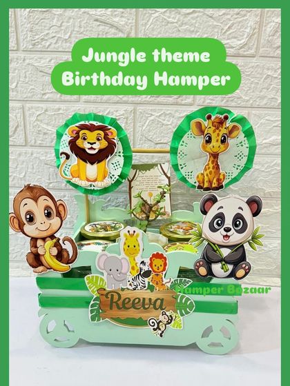 A clearer view of the personalized jungle cart hamper, showing the custom nameplate and animal toppers.