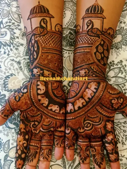 This is a beautiful example of a symmetrical bridal design. I used traditional motifs like elephants and peacocks, with clean lines and bold patterns for a very striking look.