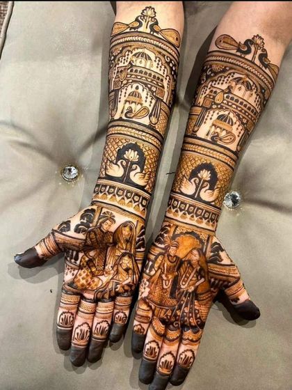 This elegant design showcases a wedding ceremony on the palms, with graceful swan and lotus motifs on the forearms, topped with palace domes.