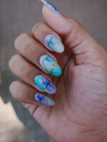 A dreamy, watercolor-style painting of orchids on a matte base.
