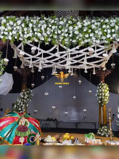 A detailed shot of the traditional bell mantap, showcasing the intricate flower work and hanging bells.