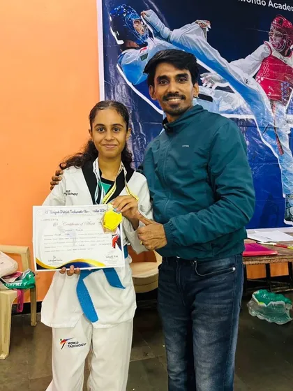 Celebrating Laisha Juneja's gold medal win at the Raigad District Championship, which secured her selection for the state-level competition.