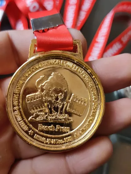 The bench press gold medal from the 2022 Senior Nationals.