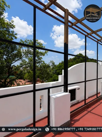A close-up of the pergola's side railing and vertical supports, showcasing the minimalist design.